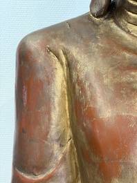 A very large Burmese mica-inlaid gilt-lacquered wooden Mandaly Buddha, 20th C.