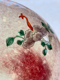 An unusual Chinese famille verte copper-red-ground shallow bowl with floral design, 19th C.