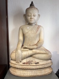 A monumental Burmese white marble Post-Pagan Buddha with traces of gilt-lacquer, Ava Kingdom, 17th C