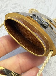 A fine Japanese four-case metal-inlaid lacquer 'Kanshin' inrō by Kōzan with a red coral ojime and a 'Jurojin' netsuke, Kōzan 光山 mark, Edo