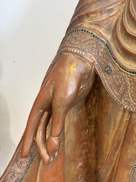 A very large Burmese mica-inlaid gilt-lacquered wooden Mandaly Buddha, 20th C.