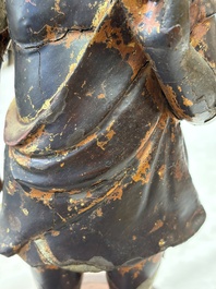 A rare Chinese gilt-lacquered bronze Buddha standing on a lotus throne, Ming