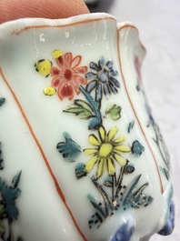 A rare Chinese famille rose moulded cup and saucer with floral design, Yongzheng