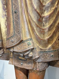 A very large Burmese mica-inlaid gilt-lacquered wooden Mandaly Buddha, 20th C.