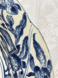Eleven Chinese blue and white gadrooned 'Flowers and Peacocks' plates, Kangxi