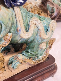 A pair of large Chinese polychrome-glazed Shiwan stoneware Buddhist lions, 19th C.