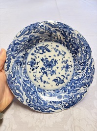 Eleven Chinese blue and white gadrooned 'Flowers and Peacocks' plates, Kangxi