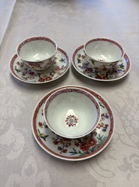Three Chinese famille rose 'Birds and Plum Trees' cups and saucers, Yongzheng