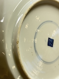 Eleven Chinese blue and white gadrooned 'Flowers and Peacocks' plates, Kangxi