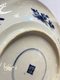 Eleven Chinese blue and white gadrooned 'Flowers and Peacocks' plates, Kangxi