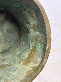 A Chinese archaic bronze wine vessel with Taotie design, Zun 尊, late Shang