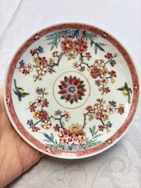 Three Chinese famille rose 'Birds and Plum Trees' cups and saucers, Yongzheng