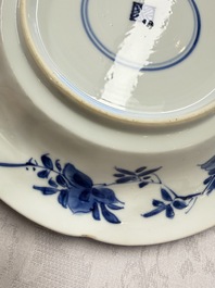 Eleven Chinese blue and white gadrooned 'Flowers and Peacocks' plates, Kangxi