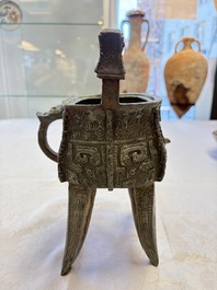 A Chinese archaic bronze wine vessel with owl design, Jia 斝, late Shang