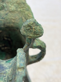 A Chinese archaic bronze wine vessel with Taotie design, Jue 爵, late Shang