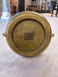 A fine Chinese bronze censer with loop handles and stand, Xuande mark, 18th C.