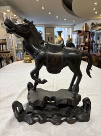 A large Chinese bronze horse-shaped incense burner and cover, 17/18th C.