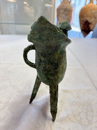 A Chinese archaic bronze wine vessel with Taotie design, Jue 爵, late Shang
