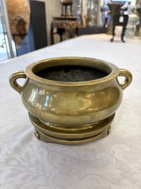 A fine Chinese bronze censer with loop handles and stand, Xuande mark, 18th C.