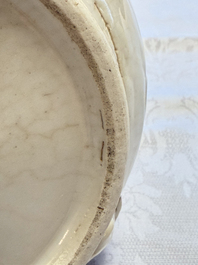 A Chinese Nanking white-glazed 'hu' vase with figural relief design, 19th C.
