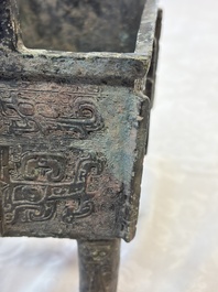 An inscribed Chinese archaic bronze food vessel with Taotie design, Ding 鼎, Western Zhou