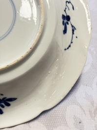 Eleven Chinese blue and white gadrooned 'Flowers and Peacocks' plates, Kangxi