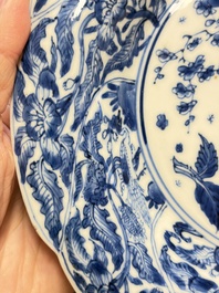 Eleven Chinese blue and white gadrooned 'Flowers and Peacocks' plates, Kangxi