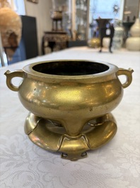 A fine Chinese bronze tripod censer and stand, Xuande mark, 17/18th C.