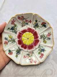 A rare Chinese famille rose moulded cup and saucer with floral design, Yongzheng