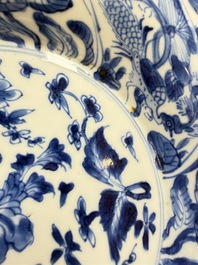 Eleven Chinese blue and white gadrooned 'Flowers and Peacocks' plates, Kangxi