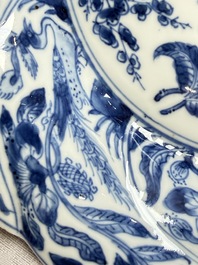 Eleven Chinese blue and white gadrooned 'Flowers and Peacocks' plates, Kangxi