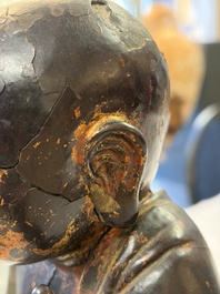 A rare Chinese gilt-lacquered bronze Buddha standing on a lotus throne, Ming