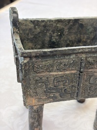 An inscribed Chinese archaic bronze food vessel with Taotie design, Ding 鼎, Western Zhou