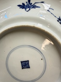 Eleven Chinese blue and white gadrooned 'Flowers and Peacocks' plates, Kangxi