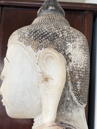 A monumental Burmese white marble Post-Pagan Buddha with traces of gilt-lacquer, Ava Kingdom, 17th C