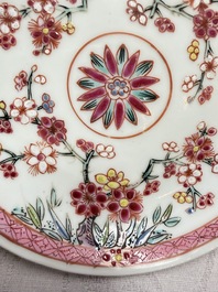 Three Chinese famille rose 'Birds and Plum Trees' cups and saucers, Yongzheng