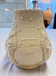 A Chinese Nanking white-glazed 'hu' vase with figural relief design, 19th C.