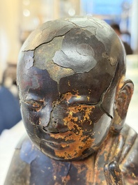 A rare Chinese gilt-lacquered bronze Buddha standing on a lotus throne, Ming