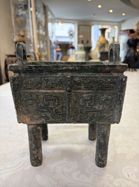 An inscribed Chinese archaic bronze food vessel with Taotie design, Ding 鼎, Western Zhou