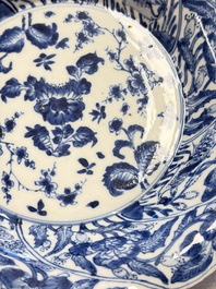 Eleven Chinese blue and white gadrooned 'Flowers and Peacocks' plates, Kangxi