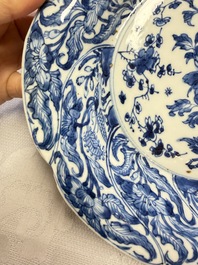 Eleven Chinese blue and white gadrooned 'Flowers and Peacocks' plates, Kangxi