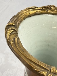 A pair of gilt-bronze-mounted Chinese famille rose capucine-ground vases and a covered bowl, Qianlong