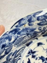 Eleven Chinese blue and white gadrooned 'Flowers and Peacocks' plates, Kangxi