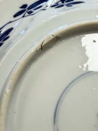 Eleven Chinese blue and white gadrooned 'Flowers and Peacocks' plates, Kangxi
