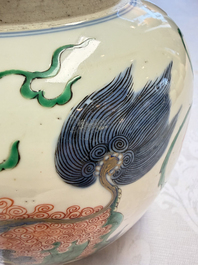 A fine Chinese famille verte 'Buddhist Lions' jar and a reticulated wooden cover, 19th C.