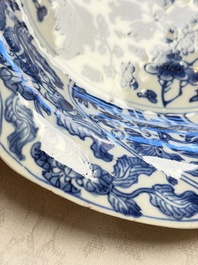 Eleven Chinese blue and white gadrooned 'Flowers and Peacocks' plates, Kangxi