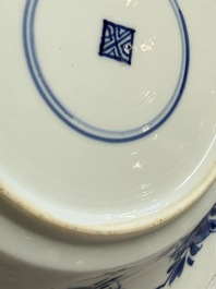 Eleven Chinese blue and white gadrooned 'Flowers and Peacocks' plates, Kangxi