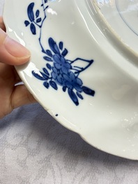Eleven Chinese blue and white gadrooned 'Flowers and Peacocks' plates, Kangxi