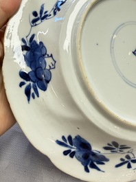 Eleven Chinese blue and white gadrooned 'Flowers and Peacocks' plates, Kangxi