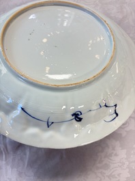 A pair of Chinese blue and white moulded dishes with dancing ladies, Kangxi